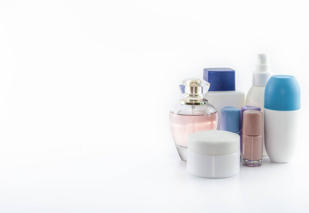 Set consisting of sun cream, parfum, nail polish, lotion. isolated. shot white background. - Photo, Image
