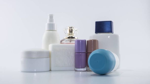 Shampoo, sun cream, nail polish, parfum. Isolated on white background - Foto, immagini