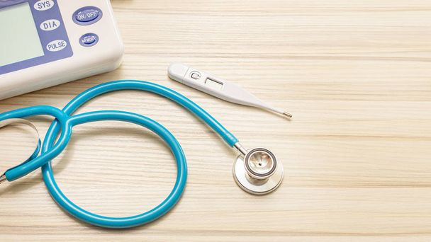 The blue stethoscopes on wood table for medical content. - Photo, Image
