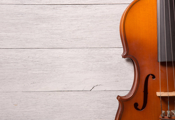 still life of vintage violin on white wooden background - Fotoğraf, Görsel