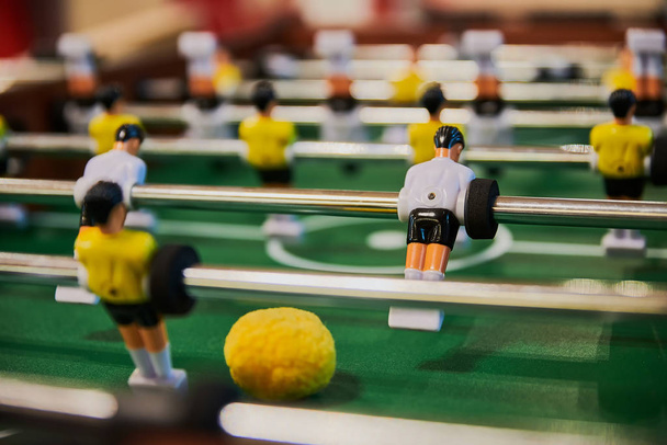 Table football, table football with close-ups of yellow and white players. - Fotografie, Obrázek