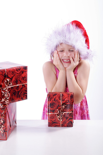 Young girl with Christmas gifts - Фото, зображення
