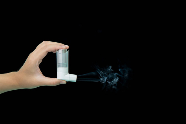 asthma inhaler with smoke on black background - Photo, Image