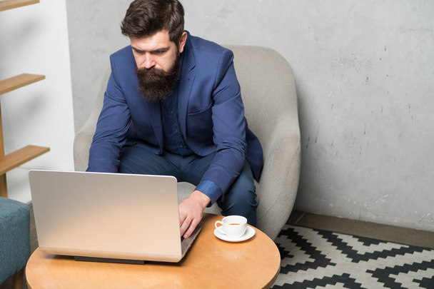 To join in the Internet revolution you need to open a laptop. Businessman working on laptop. Professional laptop computer repairman or tech worker. Bearded man using laptop in office - 写真・画像