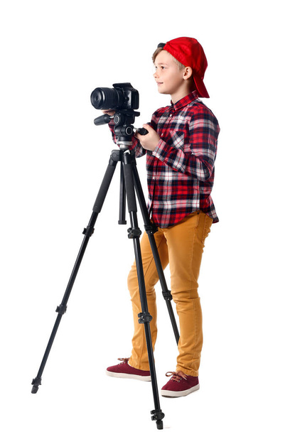 Cute little photographer with professional camera on white background - Foto, immagini