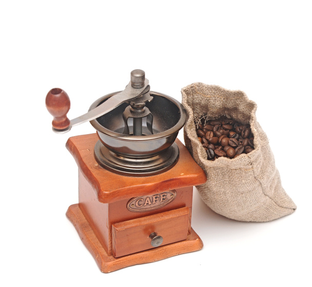 Old wooden coffee grinder, sack with coffee beans isolated on wh - Photo, Image