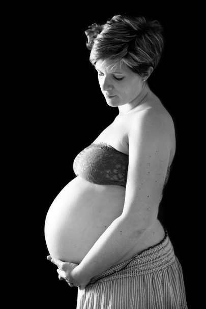 妊娠中の腹黒の背景に - 写真・画像