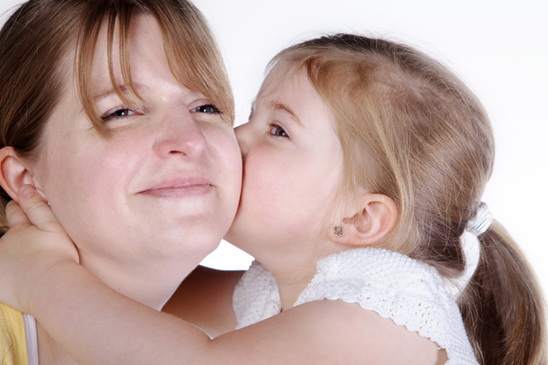 Mother and daughter kissing - Photo, image