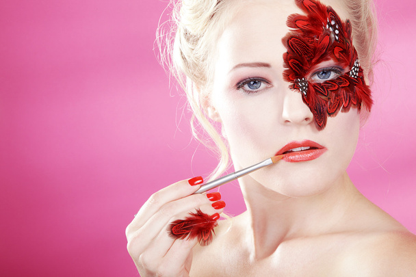 Blonde girl with painted face - Foto, imagen