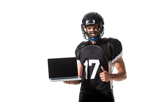 American Football player with laptop showing thumb up Isolated On White - Fotó, kép