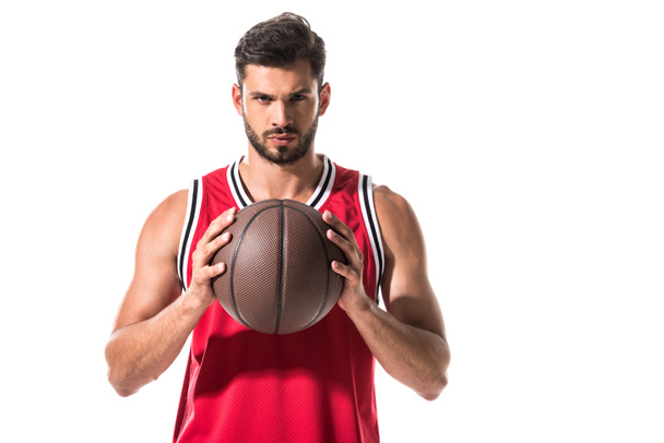 serious athletic basketball player in uniform with ball Isolated On White  - Foto, immagini