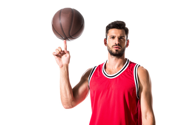 basketball player spinning on finger ball and looking at camera Isolated On White  - Photo, Image