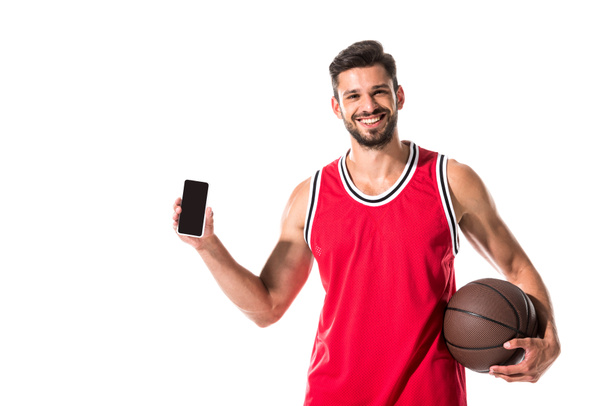 jugador de baloncesto celebración de teléfono inteligente con pantalla en blanco aislado en blanco
  - Foto, imagen