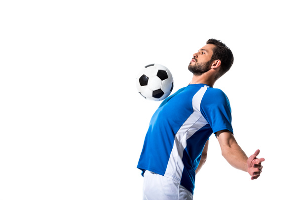 красивый футболист тренировки с мячом изолированы на белом с копировальным пространством
 - Фото, изображение