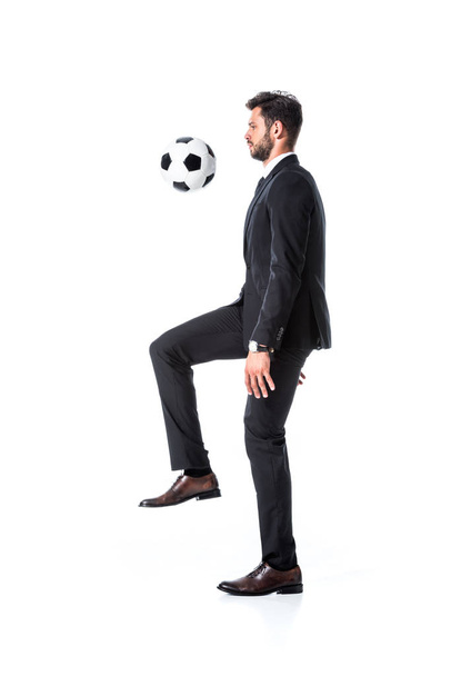 handsome businessman in formal wear training with soccer ball Isolated On White - Foto, Imagen