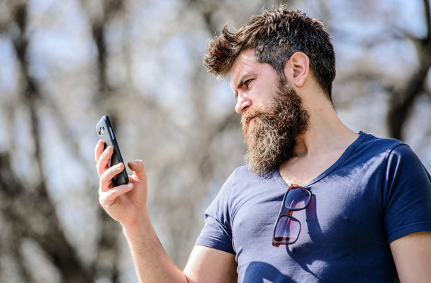 Mature hipster with beard. business talk. brutal businessman with mobile phone. bearded man speaking on cell phone. conversation and discussion. hipster man hold smartphone. searching connection - Fotografie, Obrázek