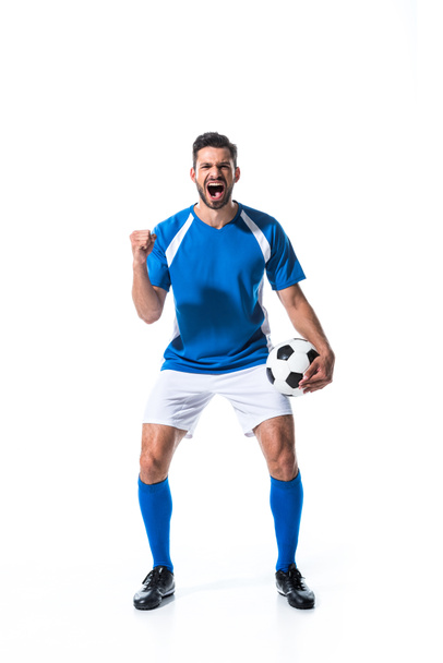 excited soccer player with ball and clenched hand yelling Isolated On White - Fotografie, Obrázek