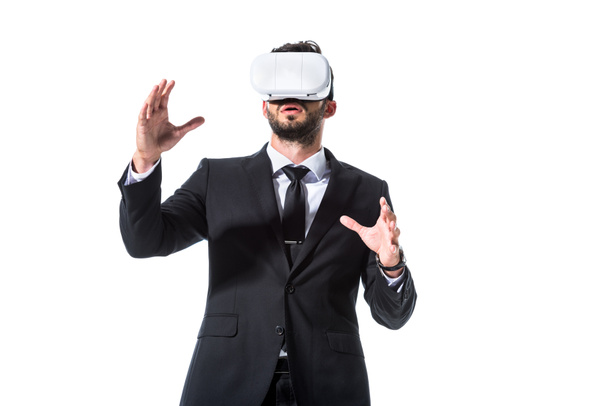businessman in formal wear and virtual reality headset gesturing Isolated On White - Foto, afbeelding