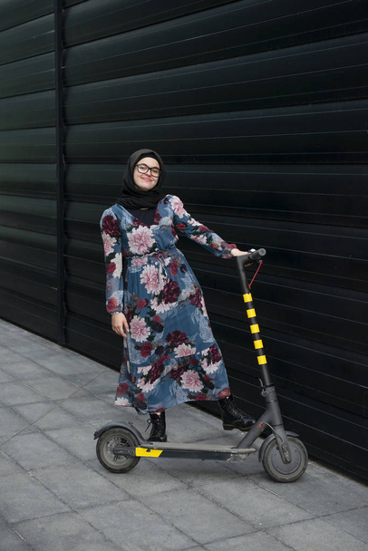 Beautiful woman on a e-scooter - Foto, immagini