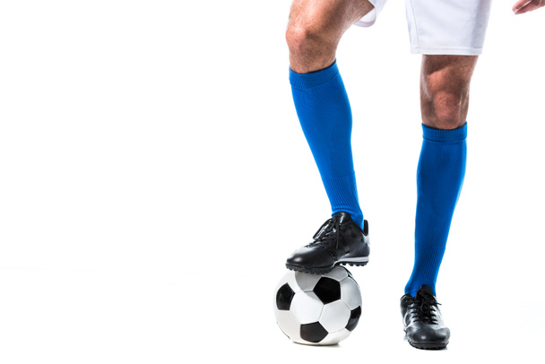 Cropped view of soccer player standing on ball Isolated On White - Foto, immagini