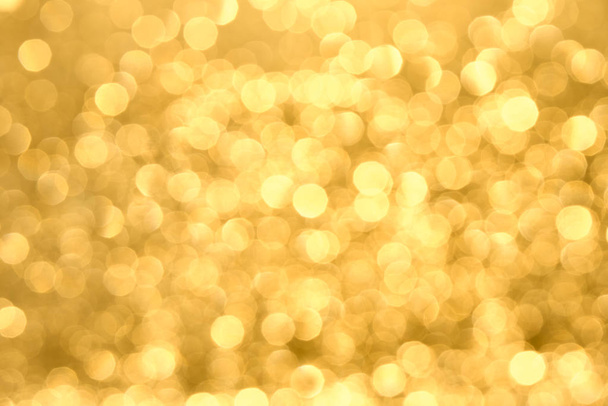 Golden yellow background with abstract blurred highlights. Bokeh in blur. - Фото, зображення