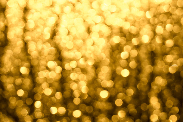 Golden-brown background with abstract blurred highlights. Bokeh in blur. - Foto, imagen
