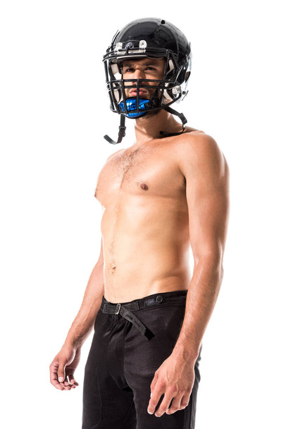 Футболист без рубашек в шлеме, изолированный на белом
 - Фото, изображение