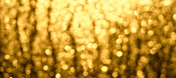 Abstract Christmas blurred background. A Golden-brown glow of Bokeh. - Foto, Bild