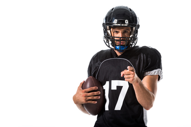 Giocatore di football americano con palla che punta con il dito isolato sul bianco
 - Foto, immagini