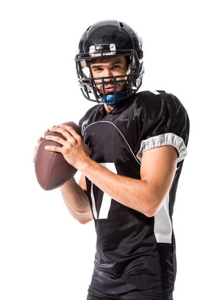American Football speler Holding bal geïsoleerd op wit - Foto, afbeelding