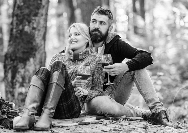 Table for two. couple in love relax in autumn forest. Family picnic. Valentines day. cheers. Red wine in fall weather. happy woman and bearded man drink wine. love date and romance. Spring mood - Fotoğraf, Görsel