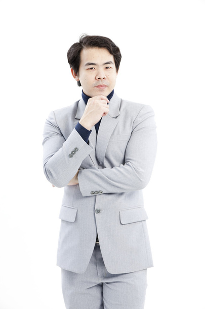 Portrait of handsome young thoughtful businessman isolated over white background - Foto, Imagem