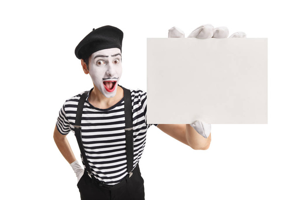 Mime with a blank card showing at the camera - Fotografie, Obrázek
