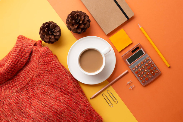Back to office concept with supplies, coffee and sweater - 写真・画像
