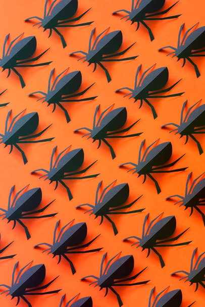 Spiders on orange background. Halloween holiday concept. Top view, flat lay and isometric - Foto, Imagem