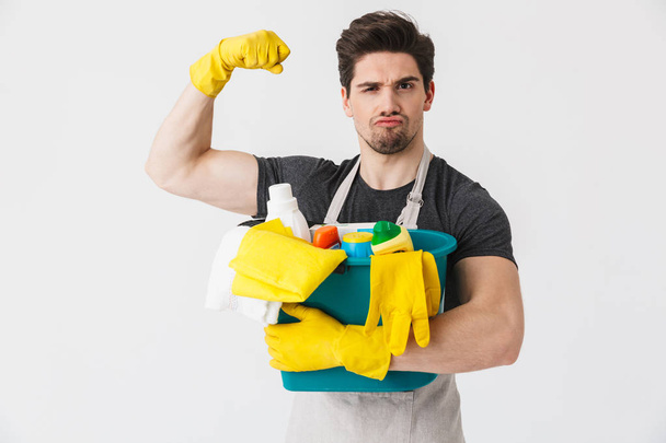 Handsome brunette houseman wearing apron - Valokuva, kuva
