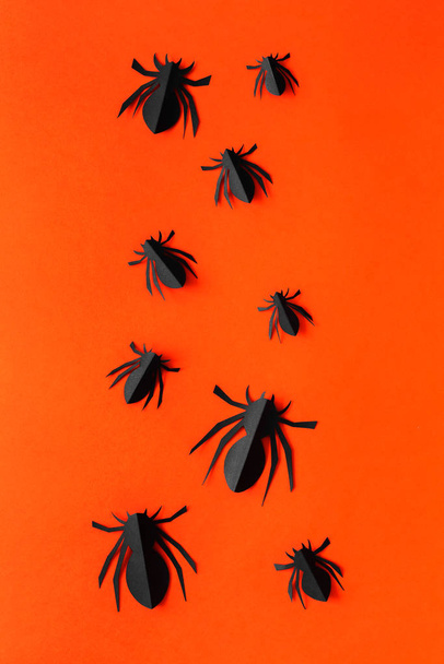 Spiders on orange background. Halloween holiday concept. Top view, flat lay - Foto, immagini
