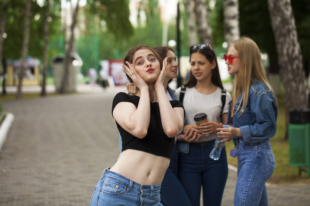 Four schoolgirls in summer park - Foto, immagini