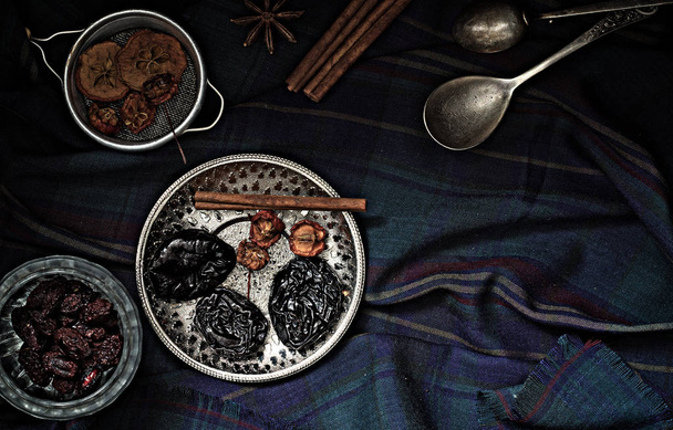 Various nuts and dried fruits in metal dishes on the table - 写真・画像