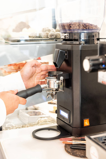 Coffee machine and barista preparing coffee in a cafe - Photo, Image
