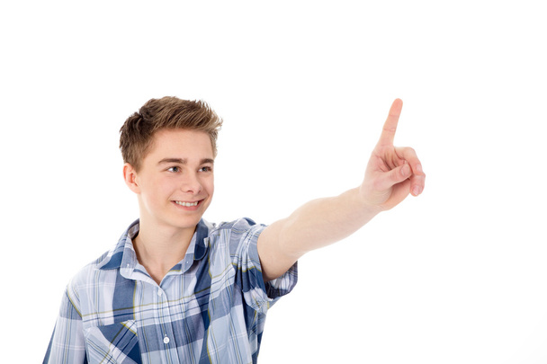 Boy pushes a finger on the screen - Фото, изображение