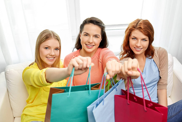 teenage girls with shopping bags at home - Φωτογραφία, εικόνα