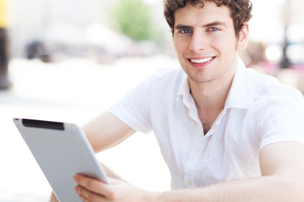 Young man with digital tablet - Photo, Image