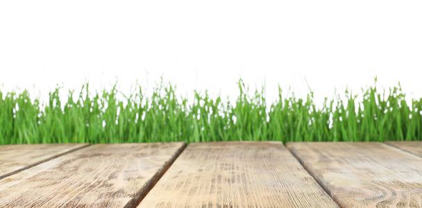 Wooden deck and green grass isolated on white - 写真・画像