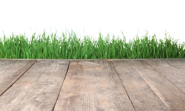Wooden deck and green grass isolated on white - Fotoğraf, Görsel