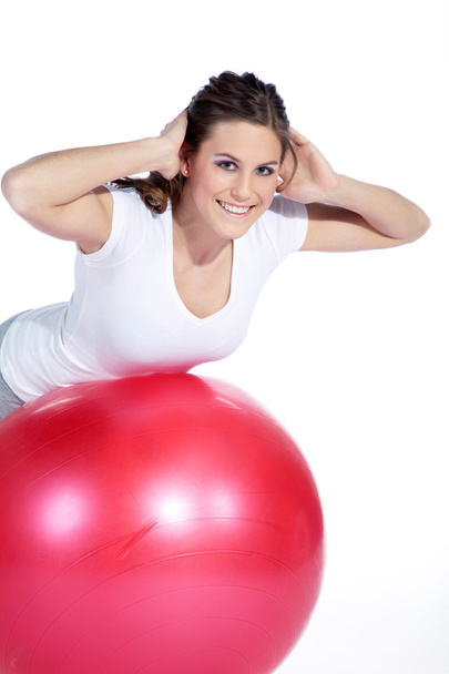 Young woman with fit-ball - Foto, imagen