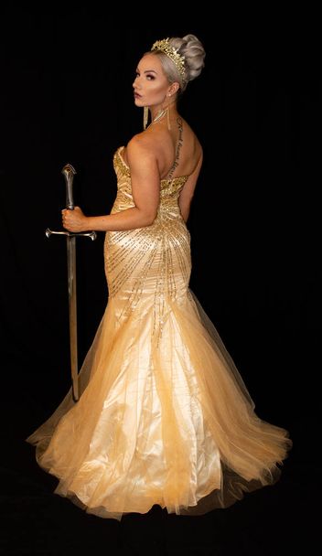 Golden goddess queen on black background - Фото, зображення