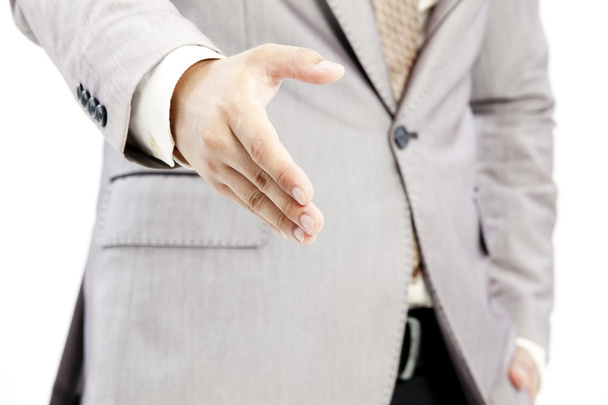 Empresário de terno dando uma mão para aperto de mão para selar o negócio
 - Foto, Imagem
