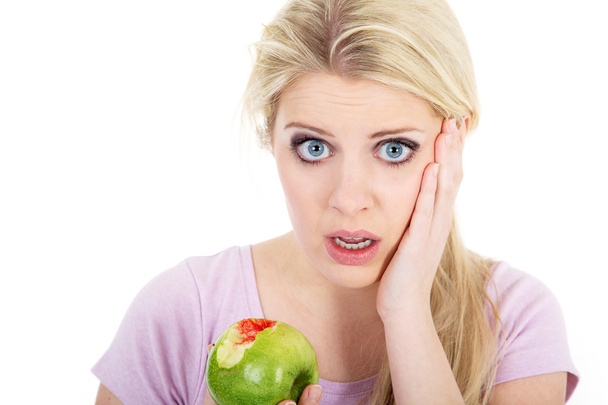 Blond woman eat green apple - Foto, Imagen