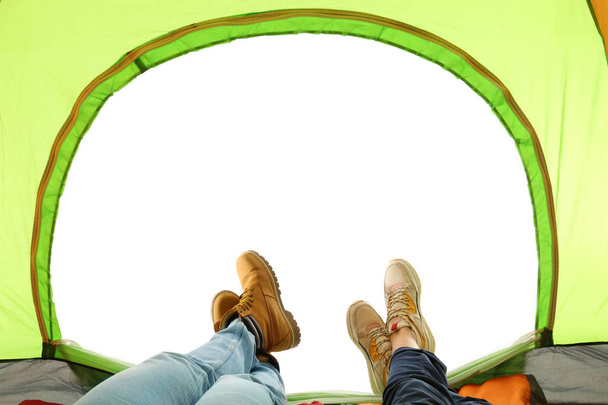 Closeup of couple in camping tent on white background, view from inside - Zdjęcie, obraz